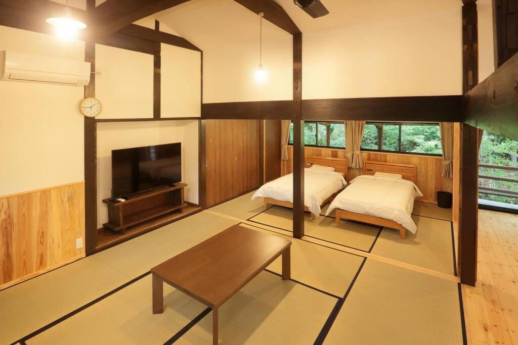 【コテージくぎの】大谷川沿いの露天風呂があるコテージ Minamiaso Exterior foto